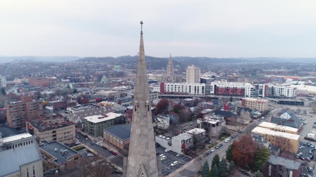 Slow-Orbiting-Aerial-View-of-Church's-Steeple-on-Overcast-Winter-Day
