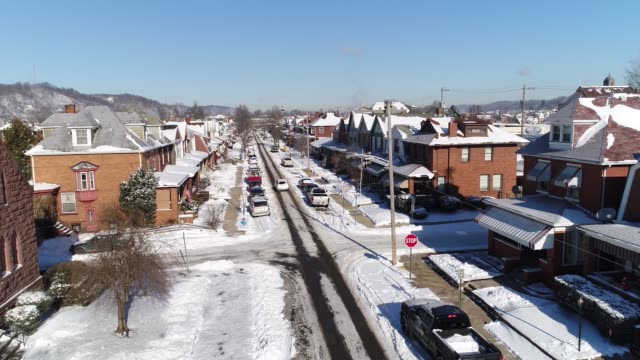 Day-Reverse-Aerial-View-of-Rust-Belt-Town-in-Winter