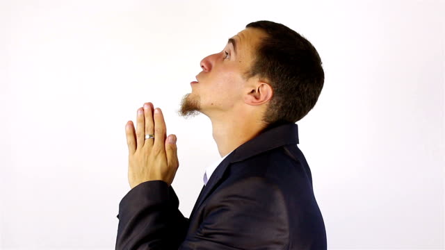 Young-bearded-man-praying,-asking-God-for-help