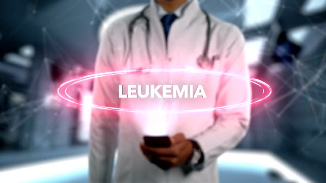 Leukemia---Male-Doctor-With-Mobile-Phone-Opens-and-Touches-Hologram-Illness-Word