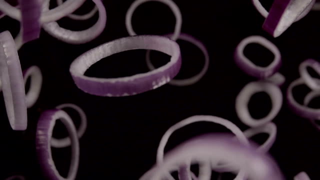 Falling-of-sliced-red-onion.-Slow-motion-240-fps