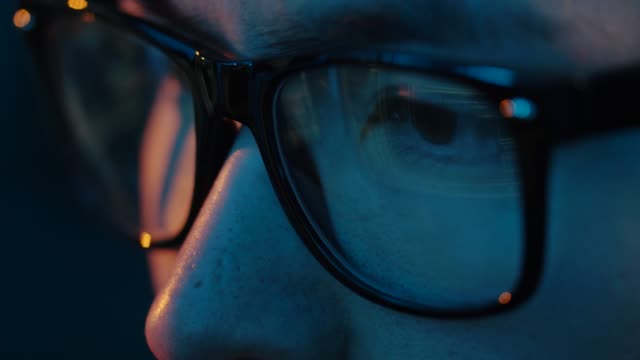 close-up-of-hacker-in-glasses-looking-at-screen