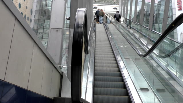 People-moving-up-on-escalator