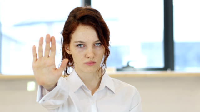 Stop-Gesture-by-Woman-in-Office