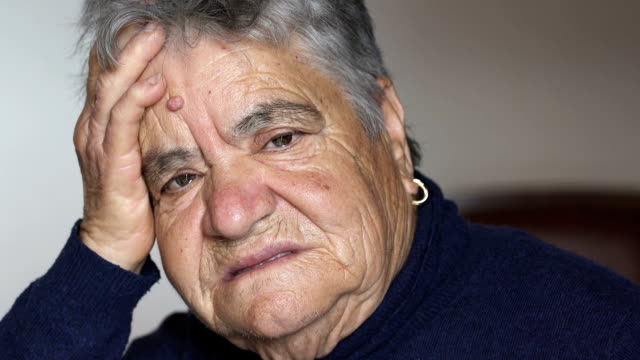 depressed-and-sad-old-woman-at-home:-lonely-old-woman-alone