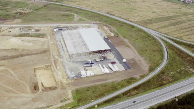 Aerial-footage-of-building-new-large-warehouse