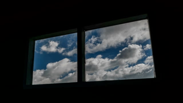 Time-lapse-shot-of-old-windows-with-clouds-moving-in-background