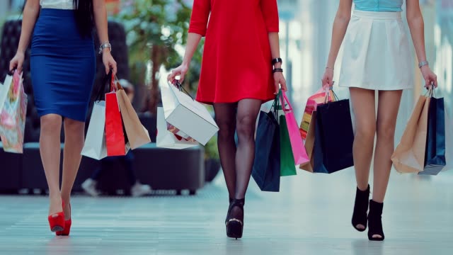 Shopaholic-female-legs-with-shopping-bags