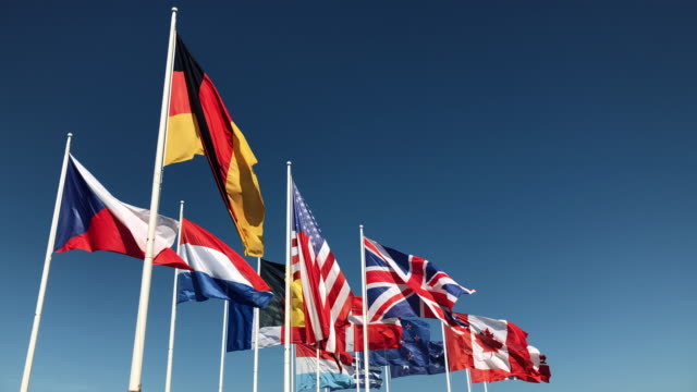 National-Flags-blowing-in-slow-motion-on-blue-sky