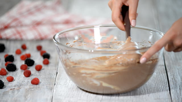 Batter-being-created-in-a-glass-mixing-bowl-in-the-kitchen.
