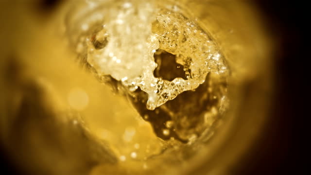 Closeup-slow-motion-pouring-beer-in-glass