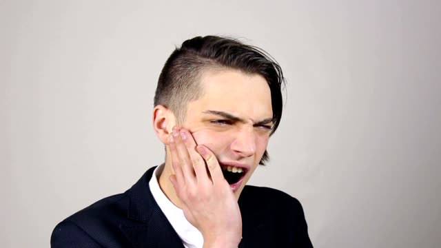 Young-businessman-with-a-toothache,-Tooth-Pain