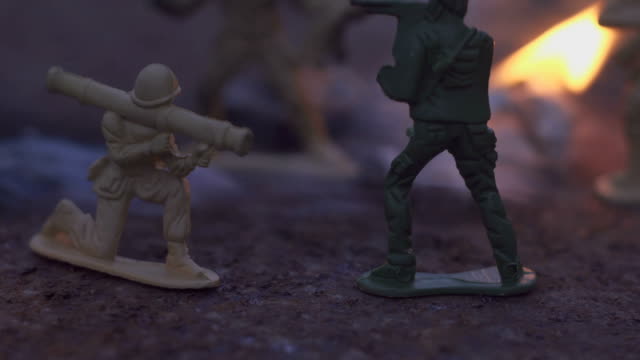 toy-soldier-in-the-fire.-The-model-of-the-battle-scene.-The-concept-of-the-cruelty-of-war