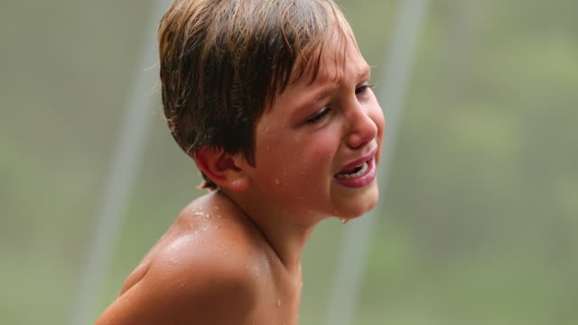 Tearful-young-boy-cries-for-having-been-hurt.-Child-in-tears