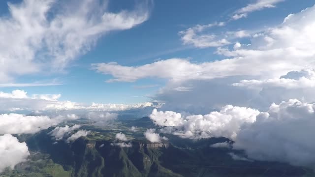 Epic-view-from-a-plane-flying-over-mountainous-region.-Aerial-Footage