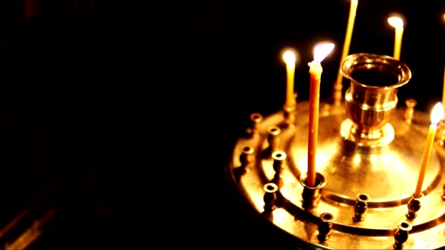 Orthodox-Church,-candles-in-the-candlestick-in-slow-motion