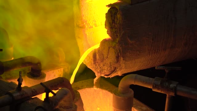 Metallurgical-production.-The-molten-metal-is-pouring-from-the-furnace,-the-hot-liquid-is-very-dangerous
