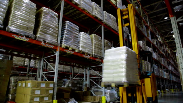 Working-forklift-inside-a-huge-warehouse