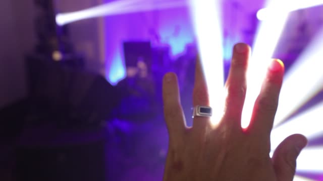 hand-raising-up-to-disco-light