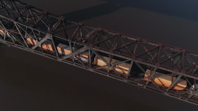 Aerial-View-Looking-Straight-Down-at-Cargo-Train-on-Bridge
