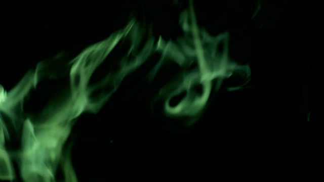 Green-Steam-Rises-from-up.-Blue-smoke-over-a-black-background.-Smoke-slowly-floating-through-space-against-black-background.-4K-UHD