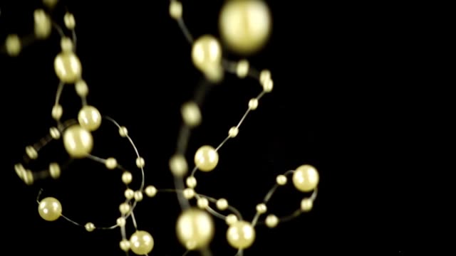Artificial-pearl-on-a-black-background.-Slow-motion.