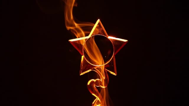gold-star-smoke-dark-background-hd-footage