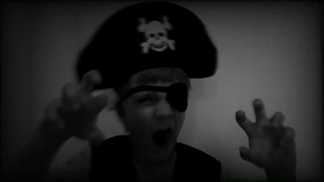 Halloween-pirate-kid-scaring,-close-up-old-video