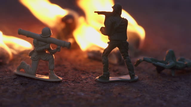 toy-soldier-in-the-fire.-The-model-of-the-battle-scene.-The-concept-of-the-cruelty-of-war