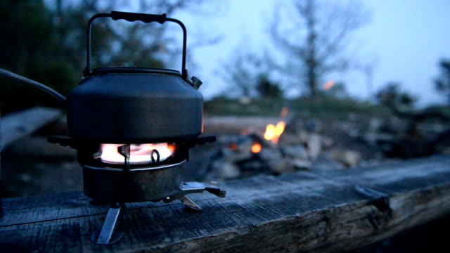 Kettle-is-heated-on-the-gas-burner-at-the-campsite