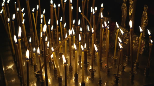 Metal-candle-light-cresset-in-church.