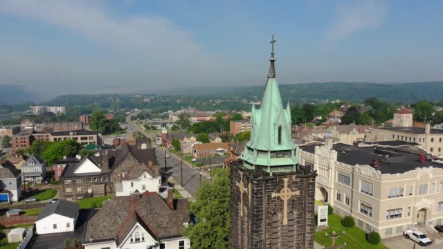 Slow-Reverse-Aerial-Establishing-Shot-of-Church-in-Small-Town-USA