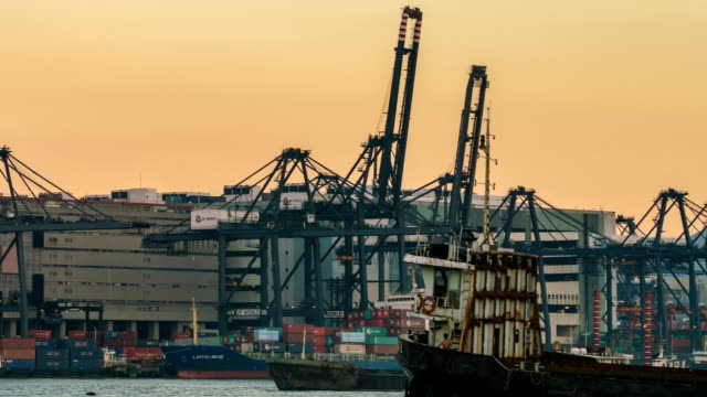 4K-time-lapse-:-working-crane-loading-bridge-in-shipyard-at-Hong-Kong-port