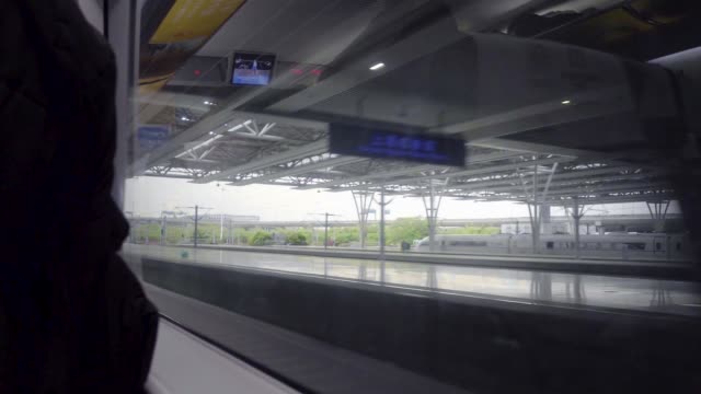 High-Speed-Bullet-Train-Departing-from-Station-Interior-View-Sunlight