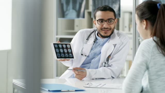 Doctor-Showing-MRI-Results-on-Tablet