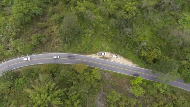 Aerial-shot-:-Car-Driving-Along-Winding-Road-on-mountain,-top-view