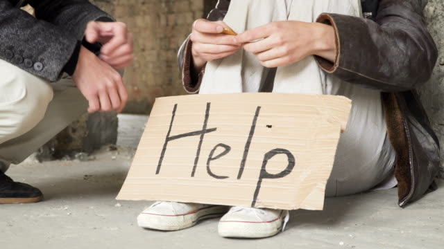 Rich-man-gives-bitcoin-to-homeless-and-people-shakes-hands
