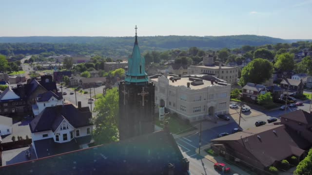 Slow-Morning-Approach-to-Church-Steeple-in-Small-Town