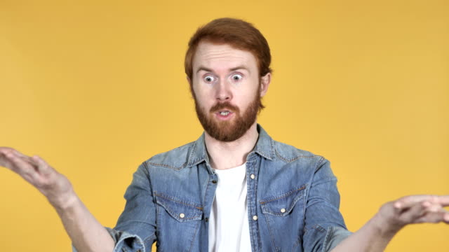 Fighting-Angry-Redhead-Man-Isolated-on-Yellow-Background