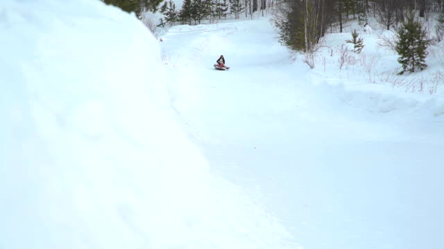 Girl-and-Woman-Riding-Fast-on-a-Sledding-Tubing