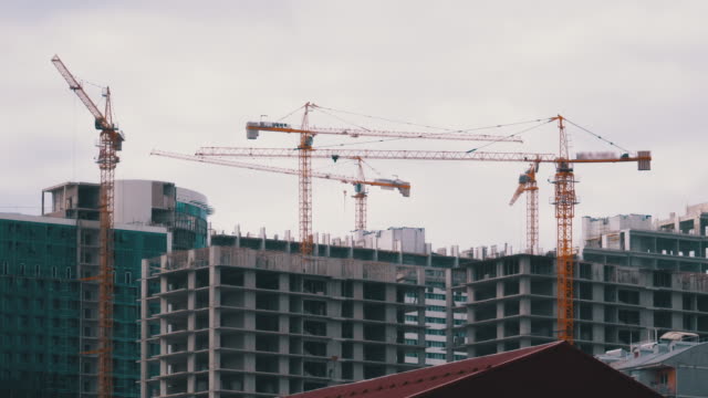 Tower-Cranes-on-a-Construction-Site-at-High-rise-Building-under-Counstruction