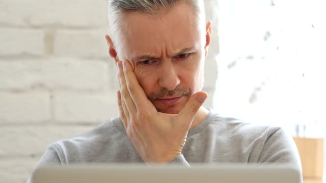 Headache,-Frustrated-Middle-Aged-Man-at-Work,-Front-View