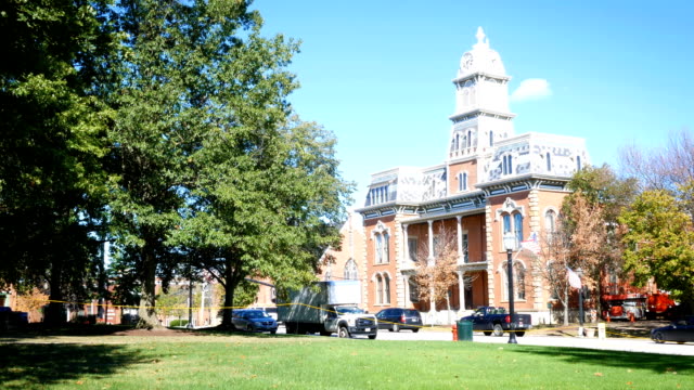 Daytime-establishing-shot-of-a-Victorian-building-in-small-american-town