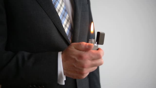 Cinemagraph-of-closeup-of-businessman-with-a-lighter-in-his-hands