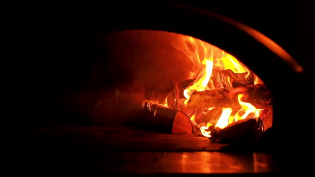 Furnace-fire.-Video-clip-of-burning-firewood-in-the-fireplace.-Firewood-burn-in-the-oven.-30fps-Full-HD-Zoom