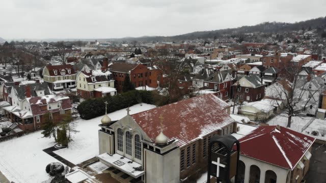 Slow-Forward-Aerial-Establishing-Shot-of-Small-Town-in-Winter