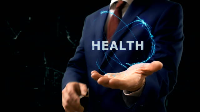 Businessman-shows-concept-hologram-Health-on-his-hand