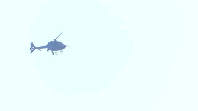 The-helicopter-is-flying-in-the-sky.