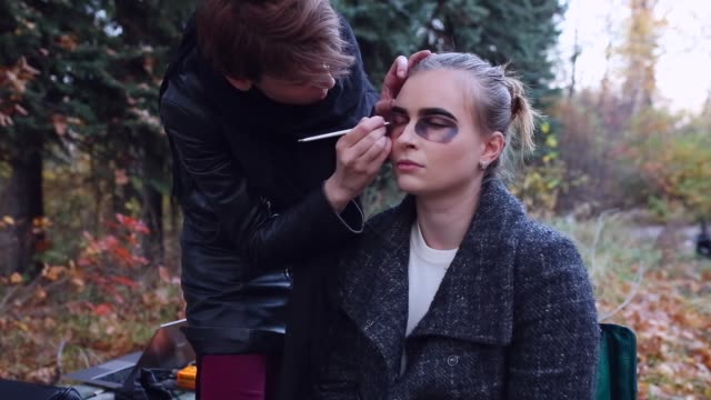 Make-up-artist-and-stylist-doing-makeup-model-for-Halloween.