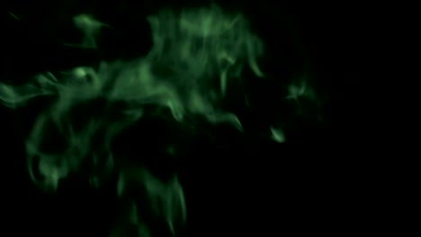 Green-Steam-Rises-from-up.-Blue-smoke-over-a-black-background.-Smoke-slowly-floating-through-space-against-black-background.-4K-UHD